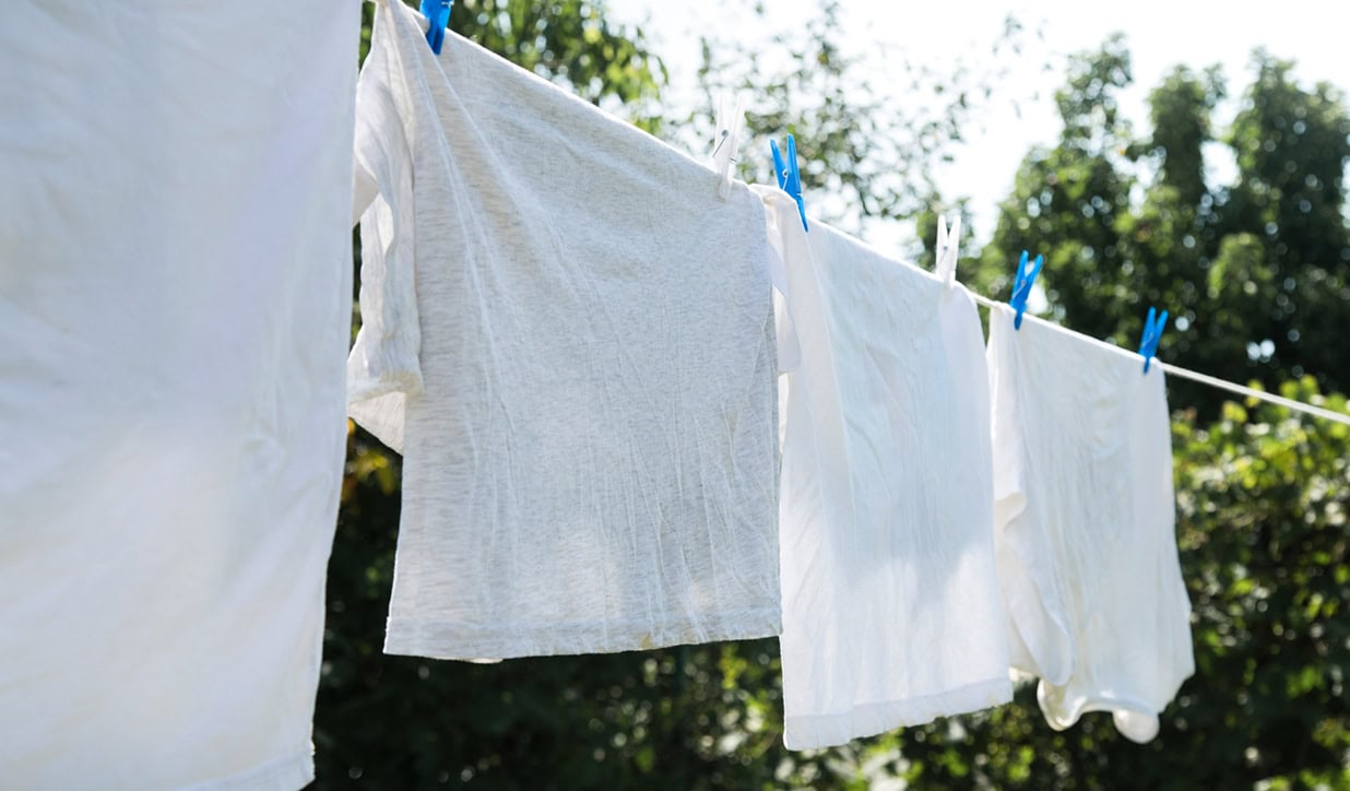 White clothes hung outdoors for air drying